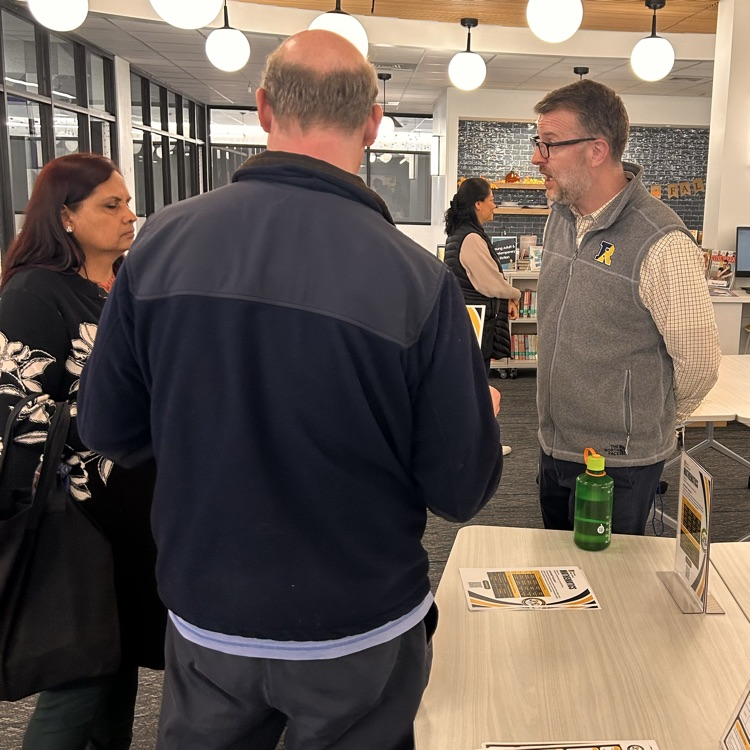 Mr. Biggan speaking with parents