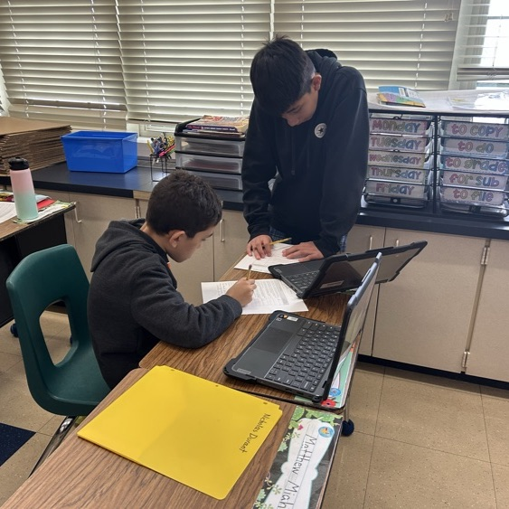 Students in 5Davidson participate in peer reviews for their Historical Fiction process pieces!