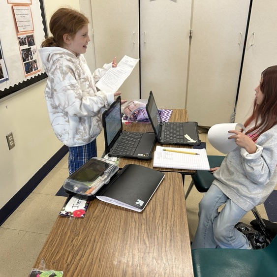 Students in 5Davidson participate in peer reviews for their Historical Fiction process pieces!