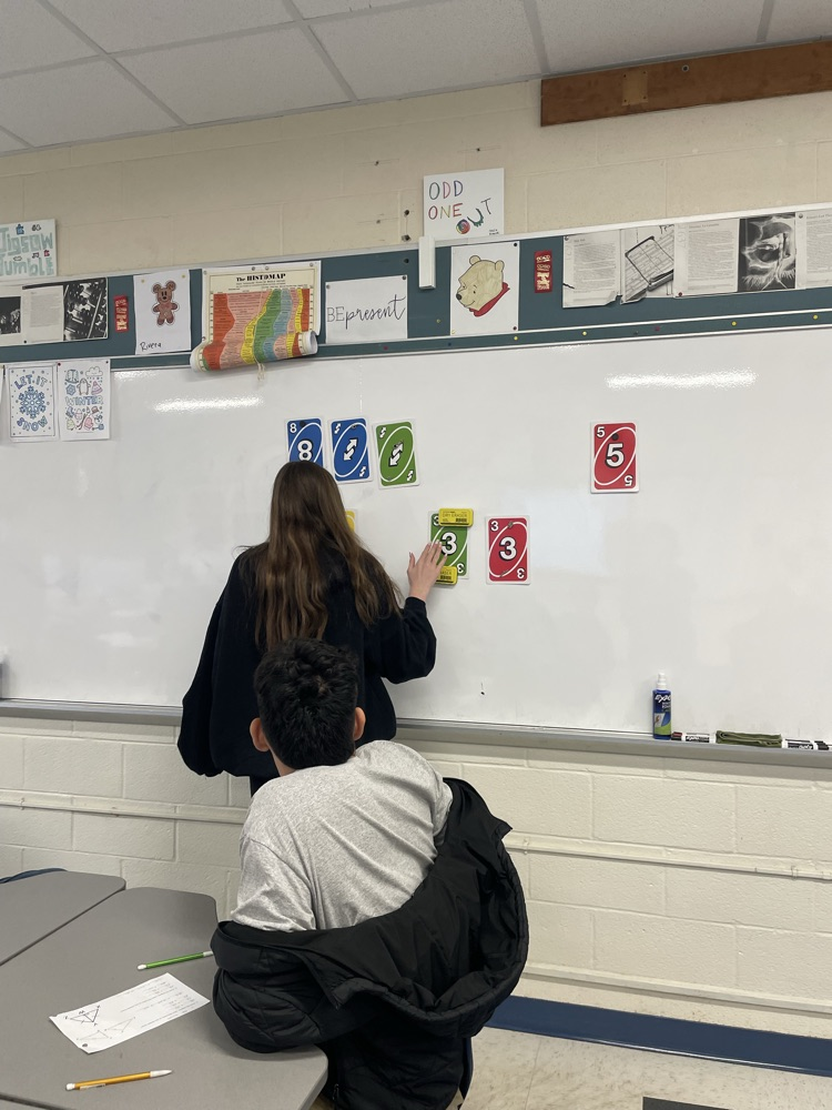 Ella Weakland uses Uno cards to demonstrate a proof.