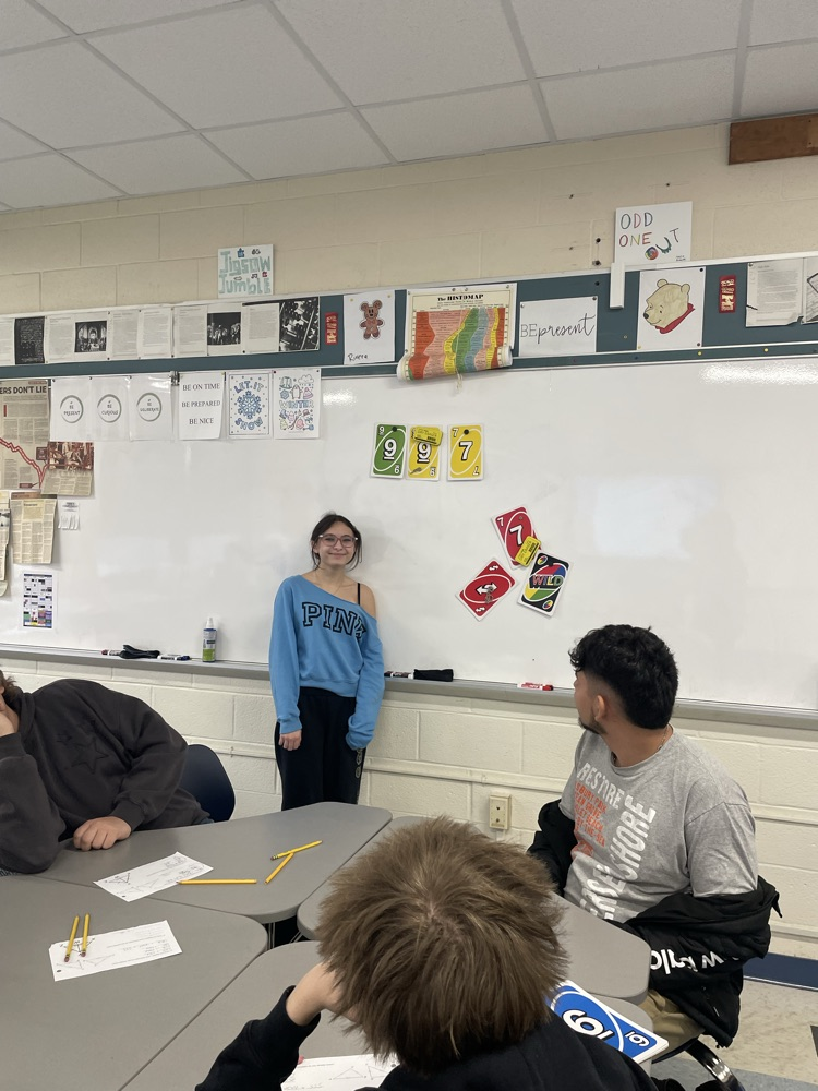 Caitlyn OβCallaghan uses Uno cards to demonstrate a proof.