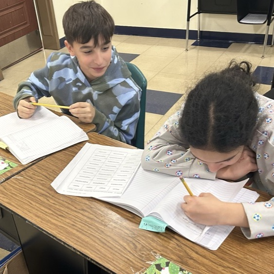 Students in 5Jo work together to create new words using 4 Greek and Latin roots.