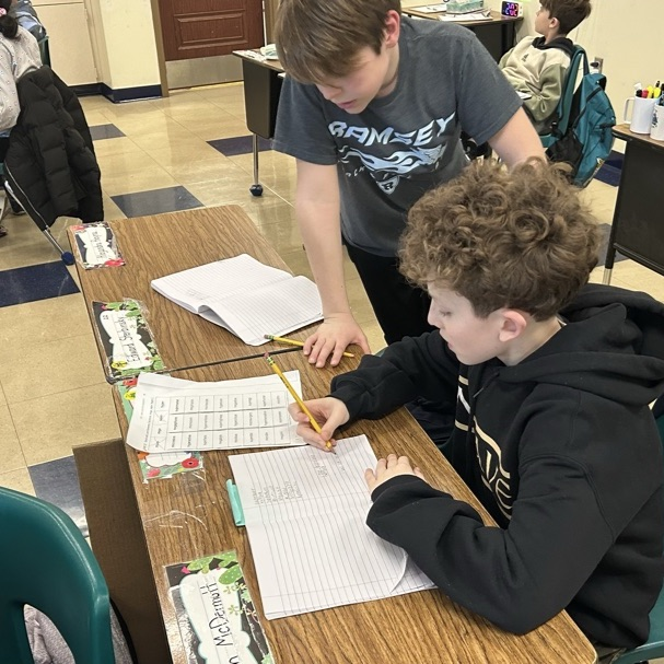 Students in 5Jo work together to create new words using 4 Greek and Latin roots.