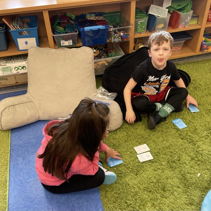 Double Compare - Who has more?Β Β How do you know? K-Col students had fun learning and playing while deciding which pair of cards shows the greater total.