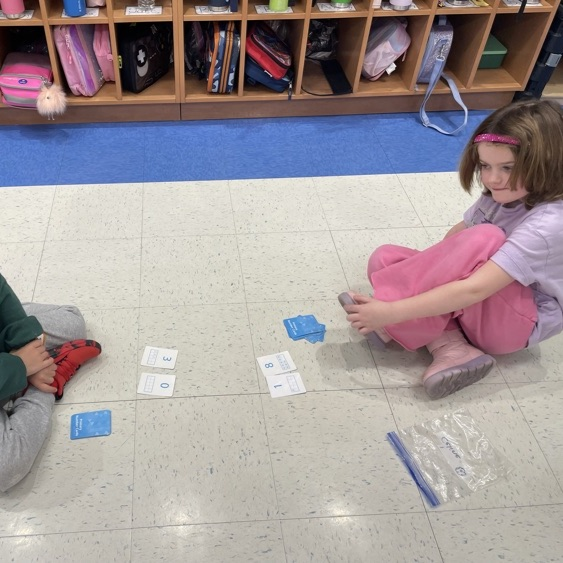 Double Compare - Who has more?Β Β How do you know? K-Col students had fun learning and playing while deciding which pair of cards shows the greater total.