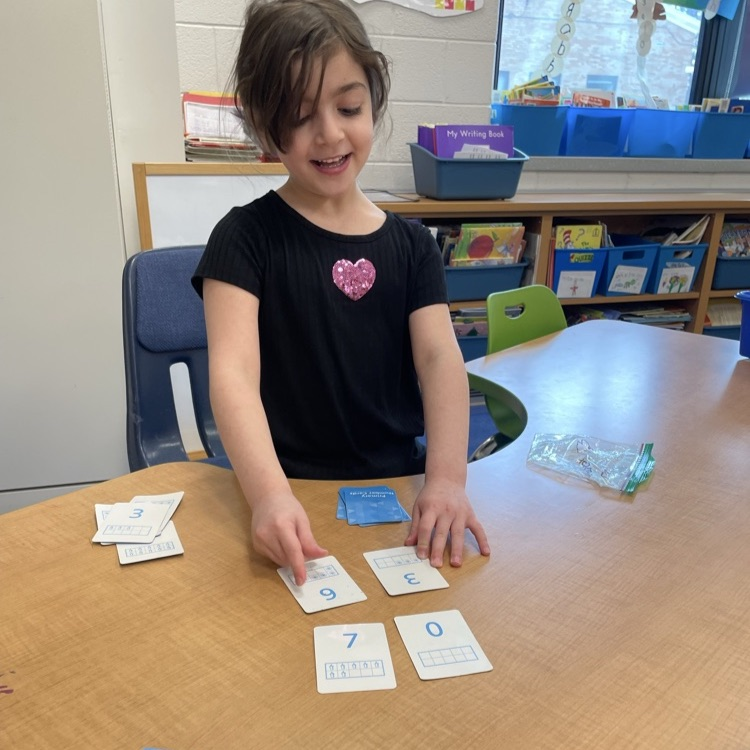 Double Compare - Who has more?Β Β How do you know? K-Col students had fun learning and playing while deciding which pair of cards shows the greater total.