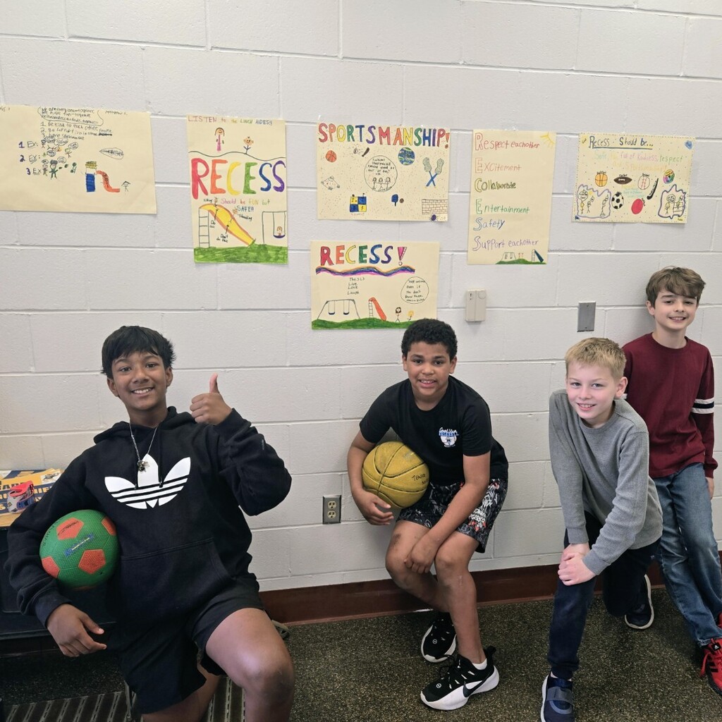 Students in 5Gesualdo/Thomson helped display their homeroom's posters promoting positive behaviors during recess.