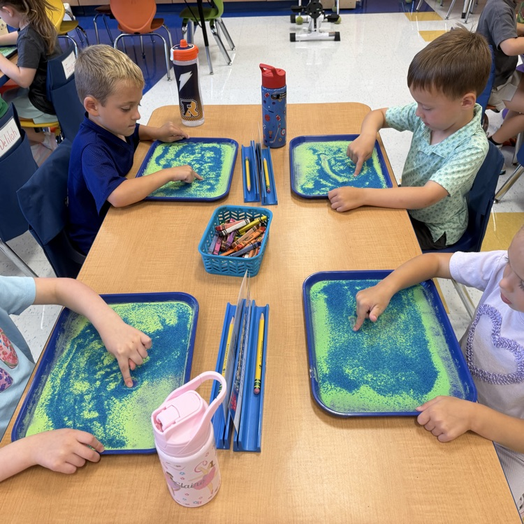 Kindergartners strengthen their dynamic awareness. Arm, tapping, red words, sand, trays, and Play-Doh provide a fun hands-on kinesthetic approach.