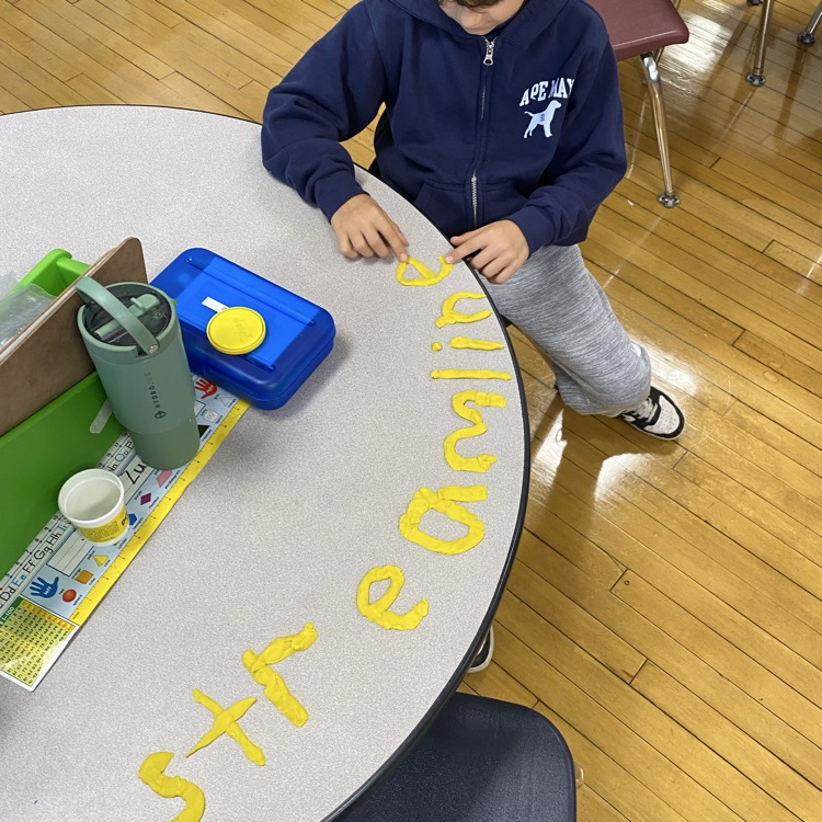 student working with play dough studying 3 consonant blends and compound words!