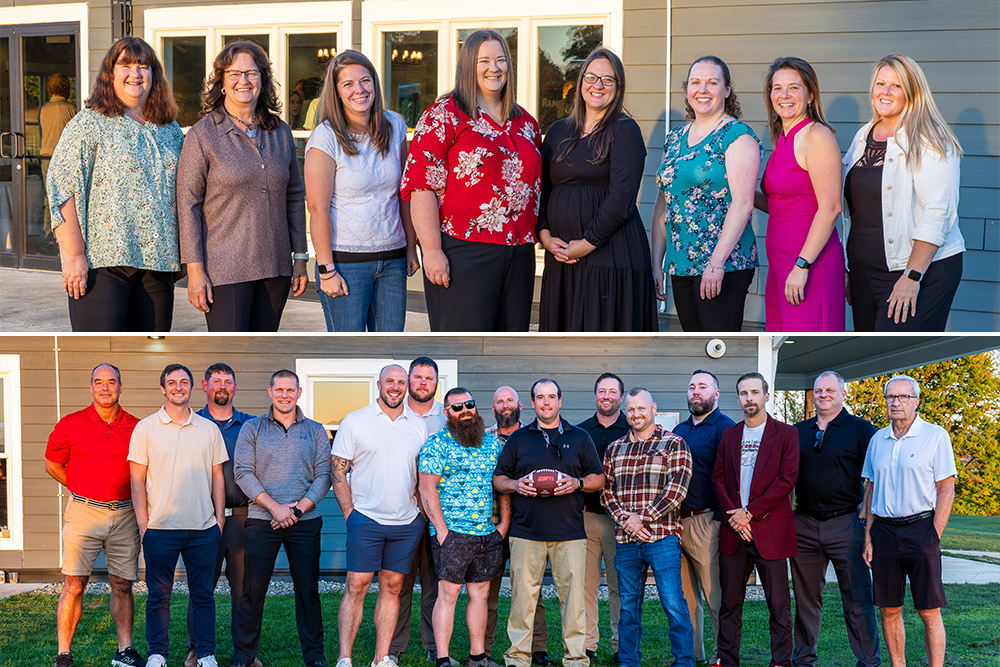 Members of the 2005 varsity volleyball and varsity football teams pose for photos
