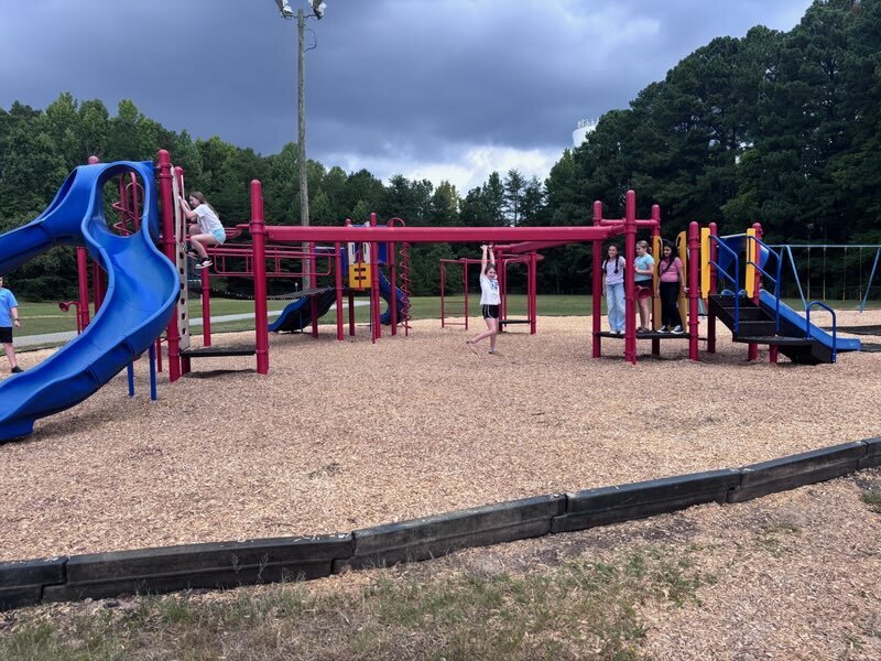 Students playing on Trindale's safer play environment.