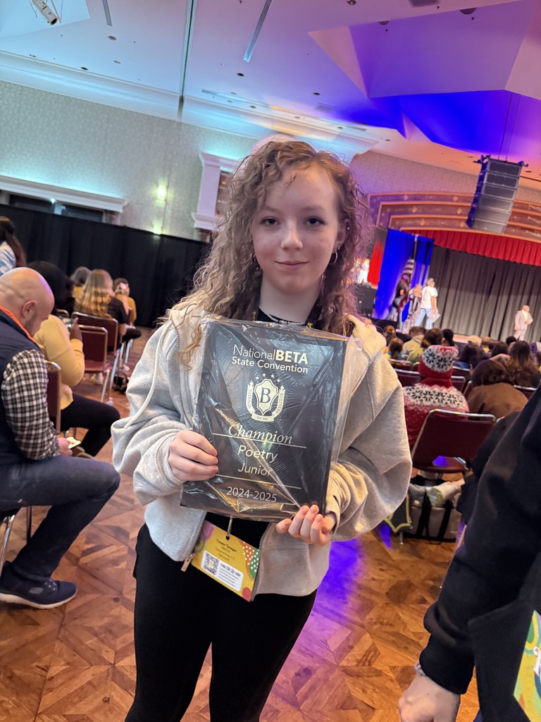 Teenage girl holding a plaque