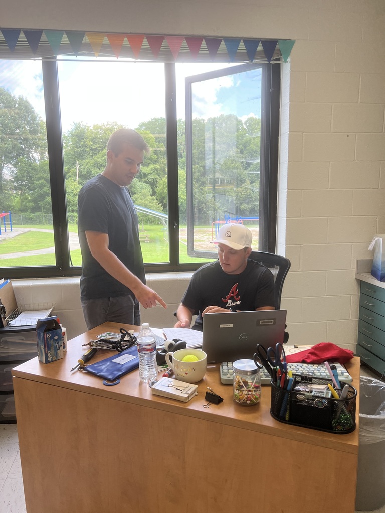 Two teachers working at a computer