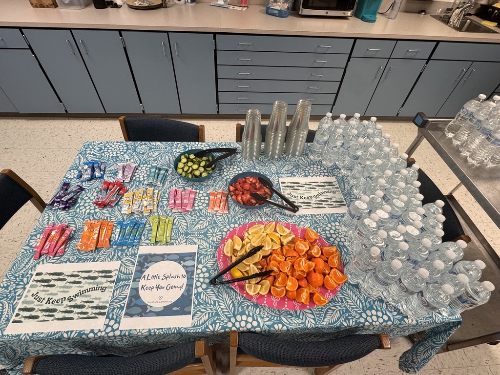 bottled water and snacks on a table