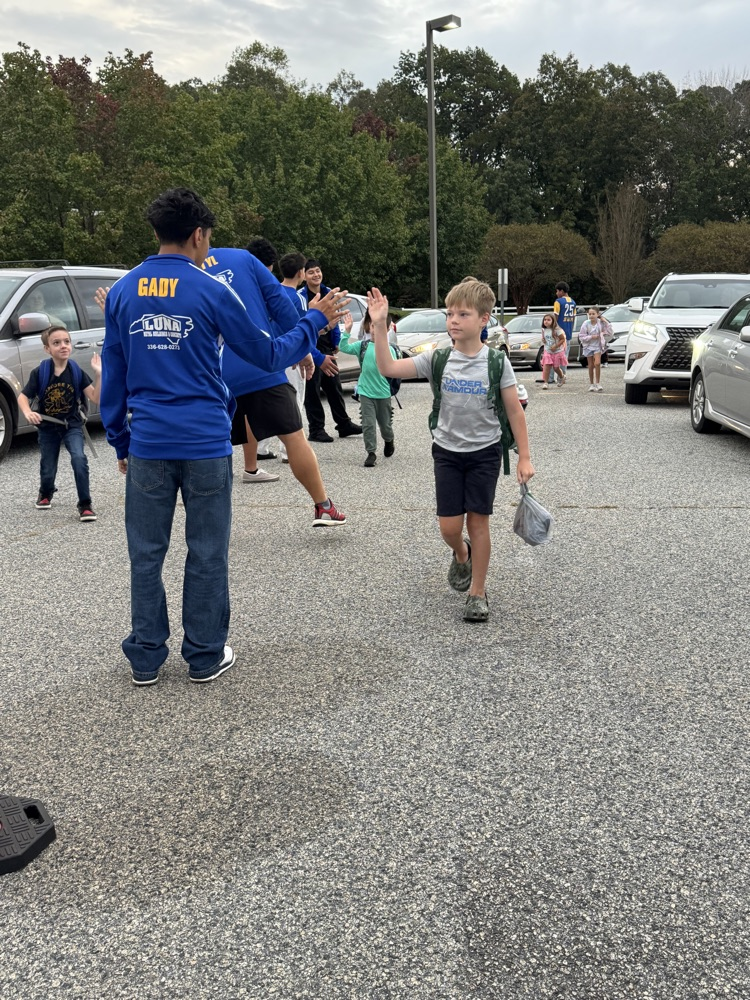 SWRHS soccer team greeting students