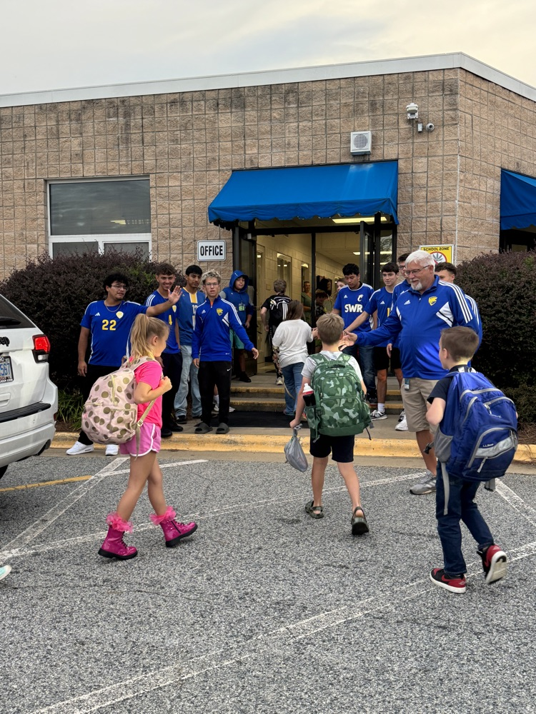 SWRHS soccer team greeting students