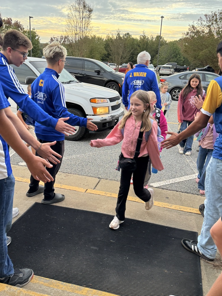 SWRHS soccer team greeting students