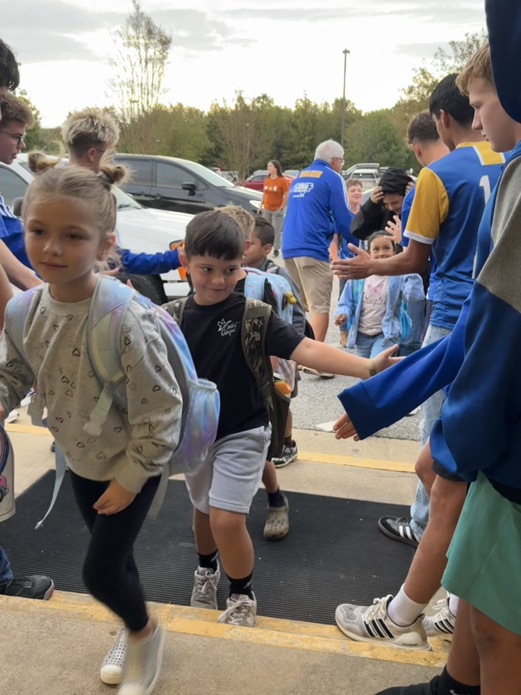 SWRHS soccer team greeting students