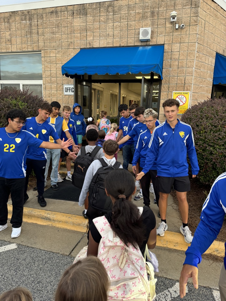 SWRHS soccer team greeting students