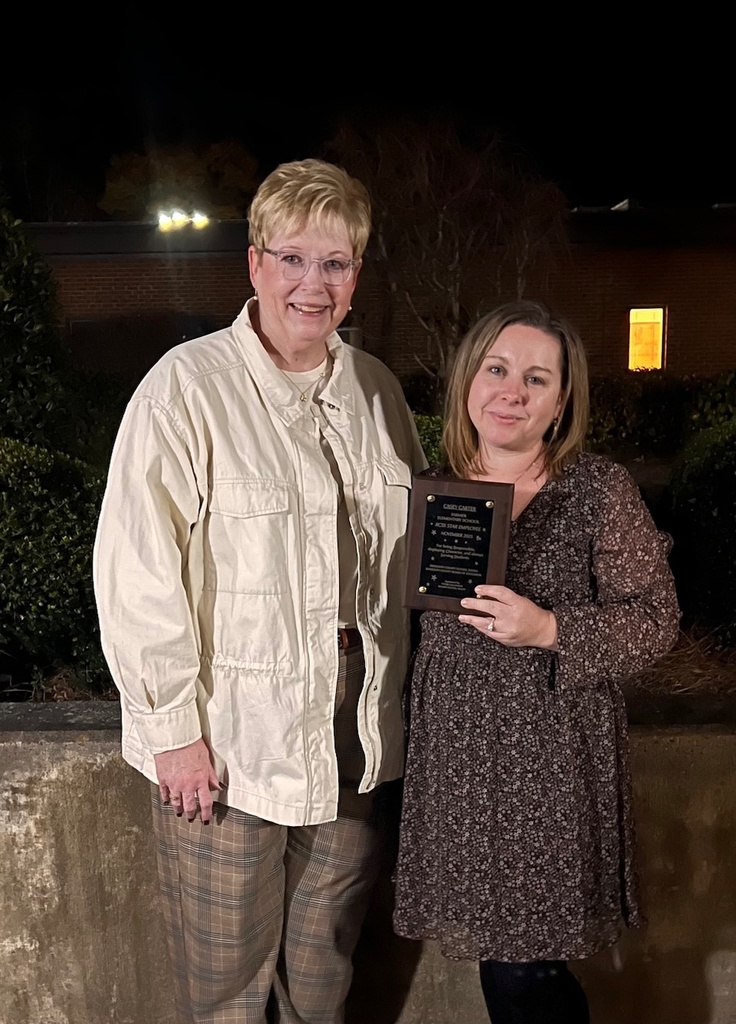 Star employee Ms. Carter receiving her award with Farmer principal Judi Cagle.