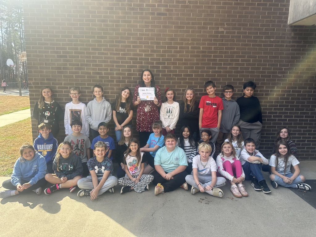 Ms. Overton standing with her class after receiving her grant.