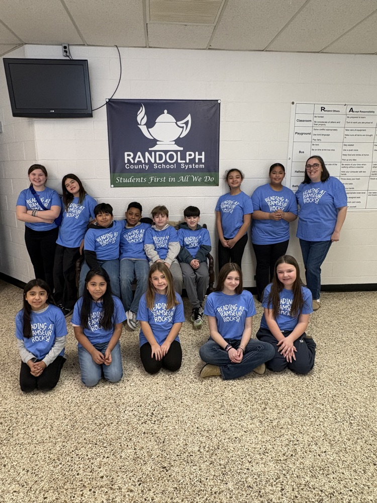 13 kids plus Ms Robinson in blue Reading Rocks at Ramseur shirts