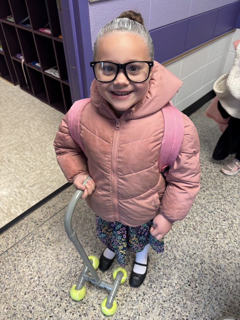 A kindergarten student dressed up as an old lady on the 100th day of school.