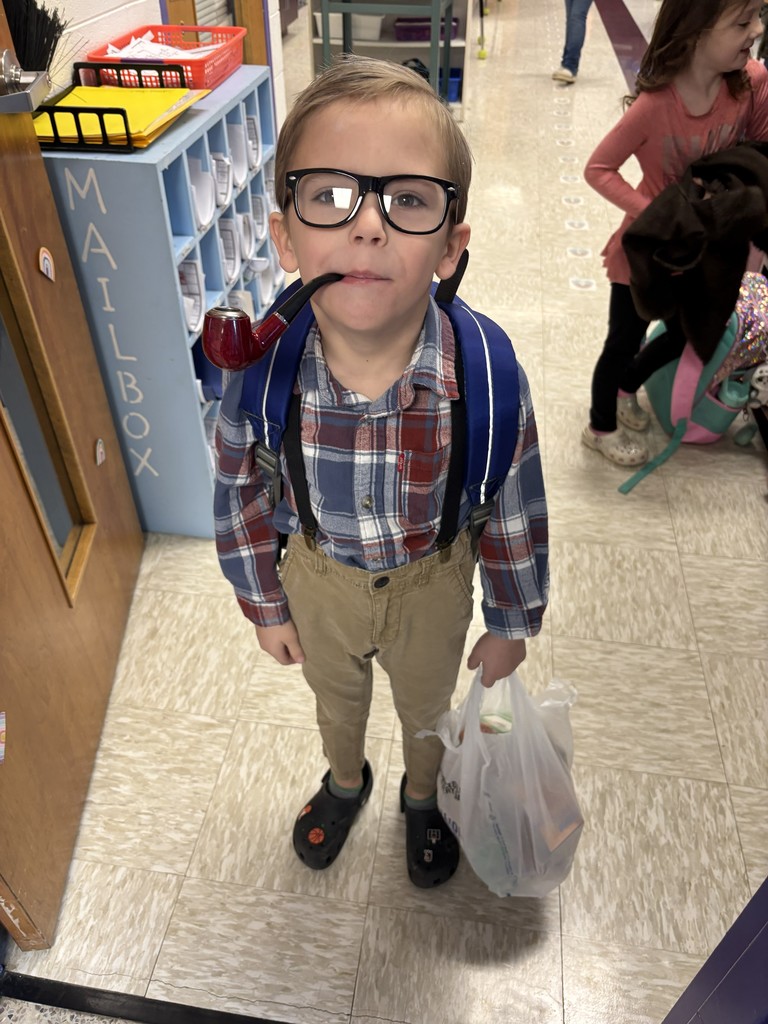 A young student dressed as an old man on the 100th day of school.