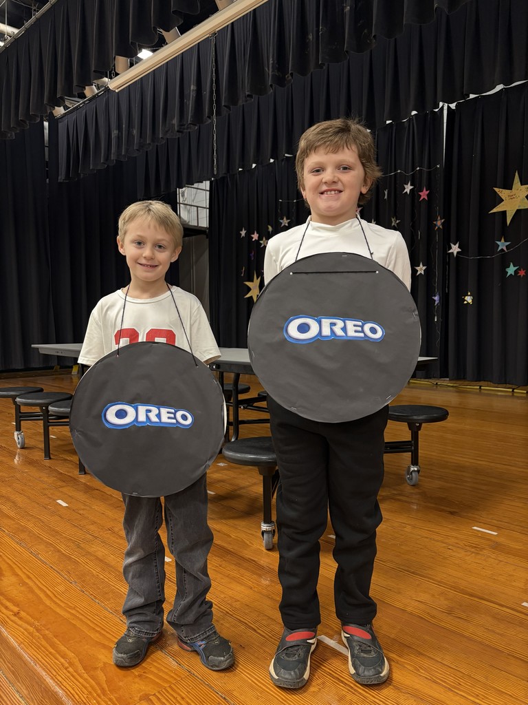 Two boys wearing Oreo cookie outfits for Science Night.