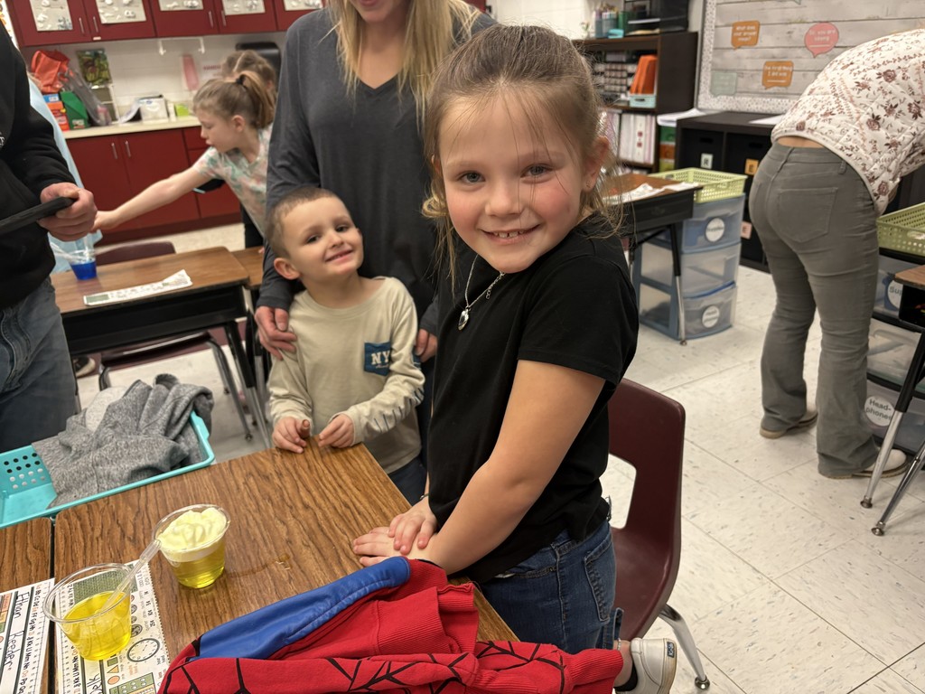Students performing science experiments in their classroom.
