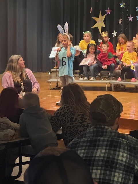 A kindergarten student saying his Letterland letter.