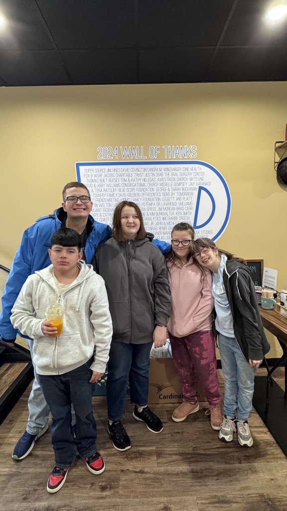 High school students at a restaurant. 