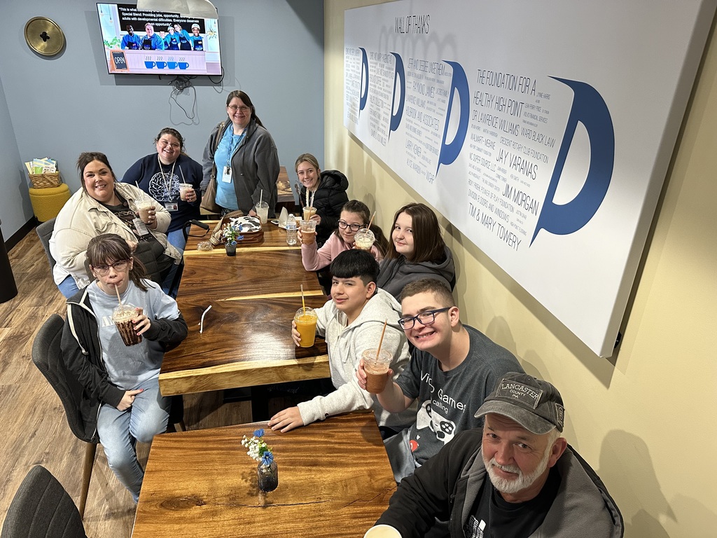 High school students at a restaurant. 