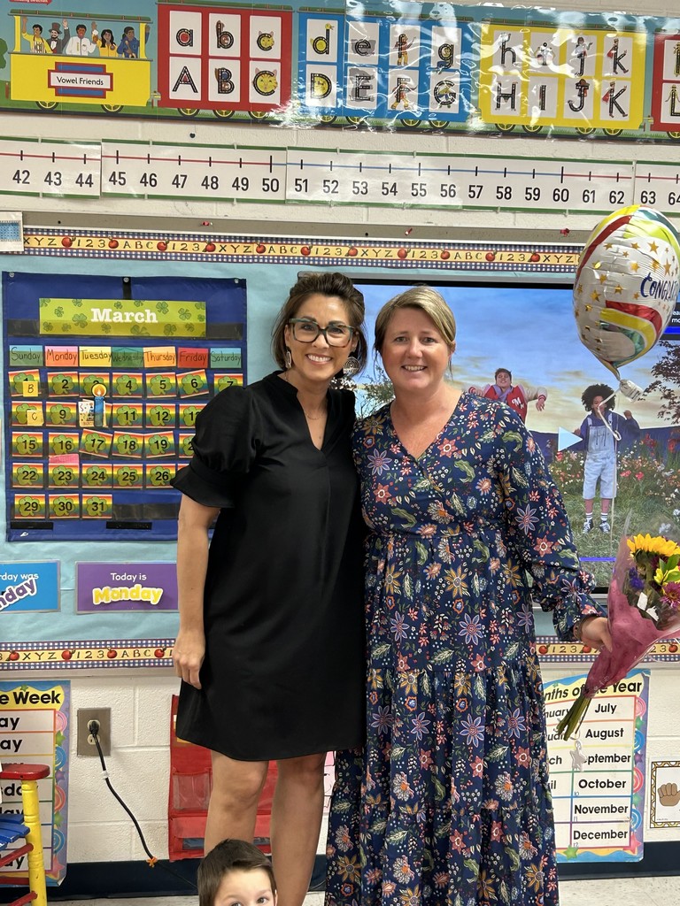 Ms. Tuluri awarding Mrs. Humble with Teacher of the Year!