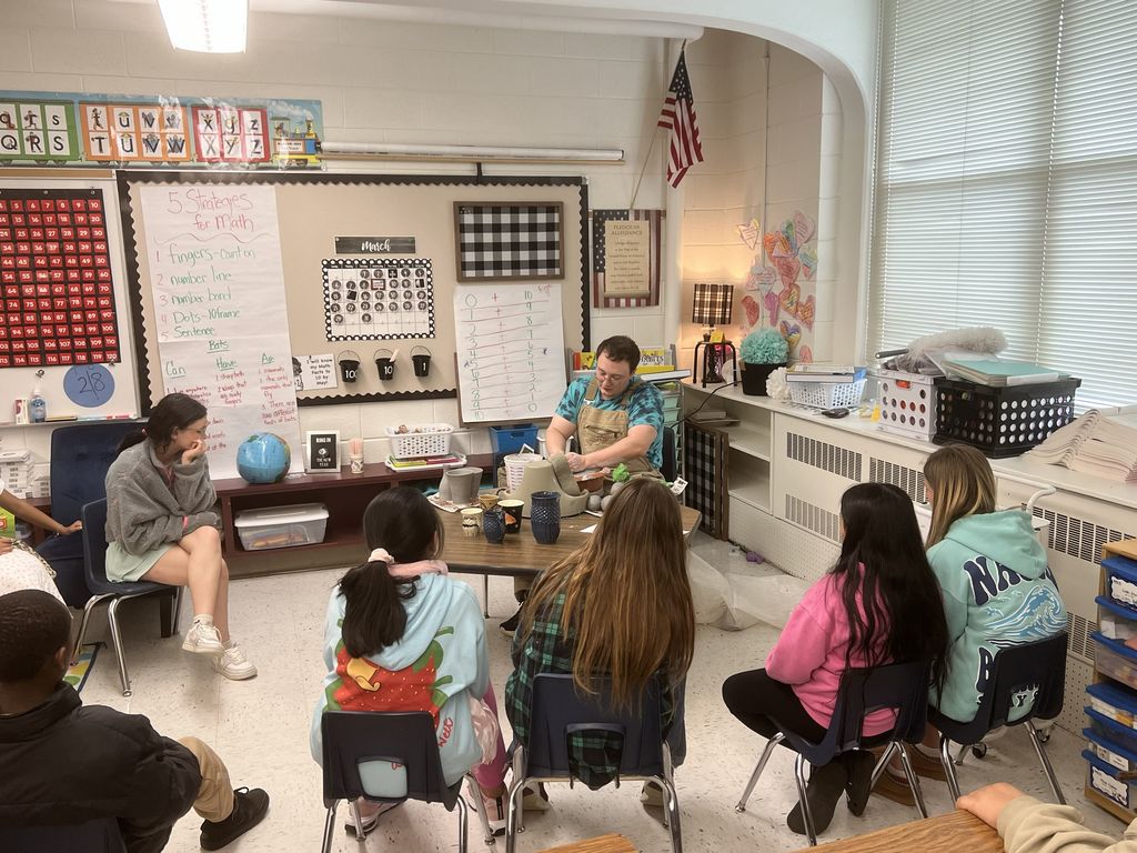 Students listening to a presentation