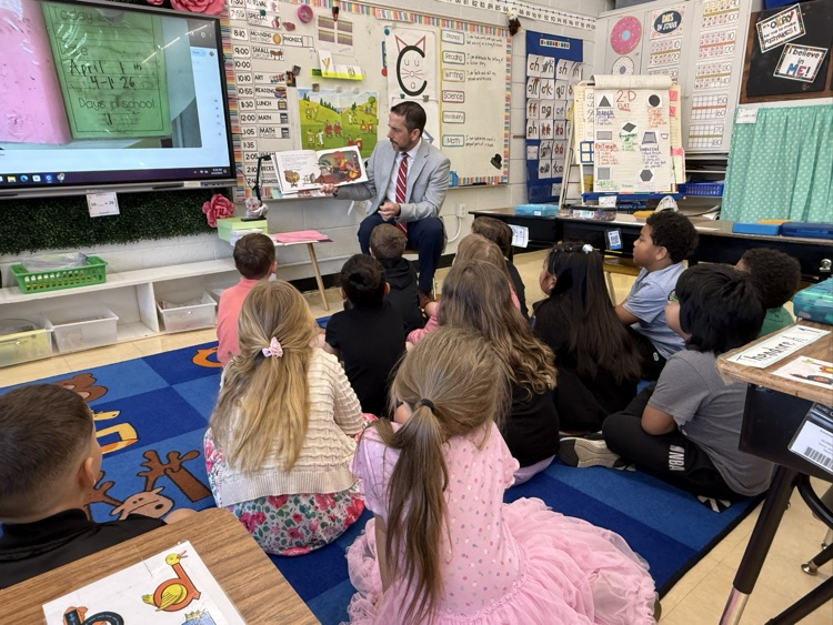 Mr. Grosch reading to a first grade class. 