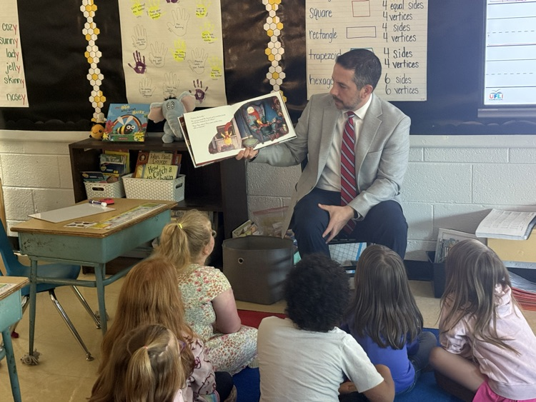 Mr. Grosch reading to Mrs. Snotherly’s first grade class. 