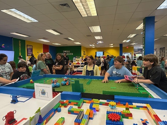 5th grade students working on robots at Brick Ed.