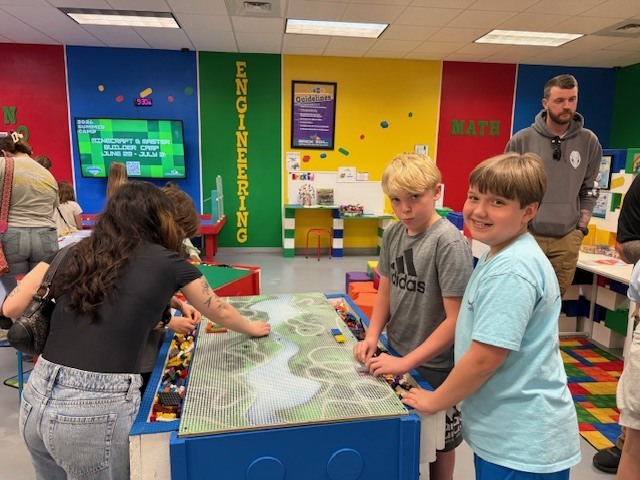 5th grade students creating things with Legos at Brick Ed.