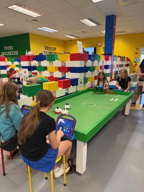 5th grade students at a soccer table at Brick Ed.