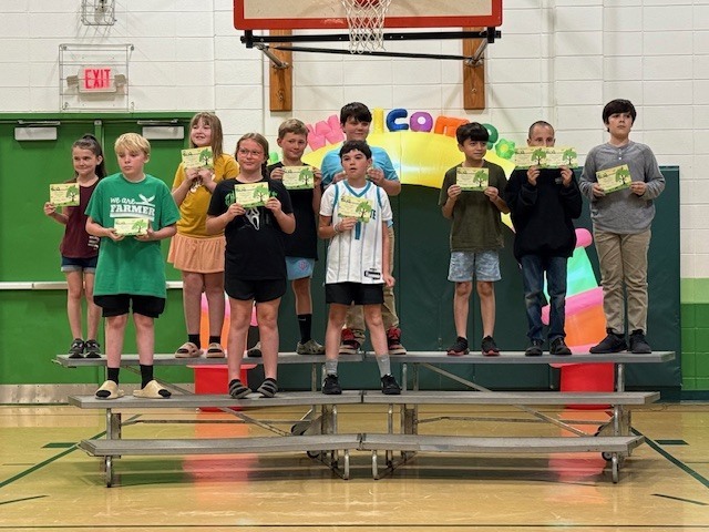 Students showing off their quarter 3 academic awards.