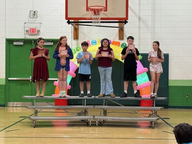 Students showing off their quarter 3 academic awards.