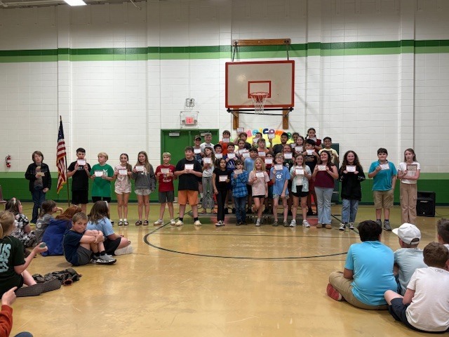 3rd, 4th and 5th grade students receiving their Perfect Attendance award.