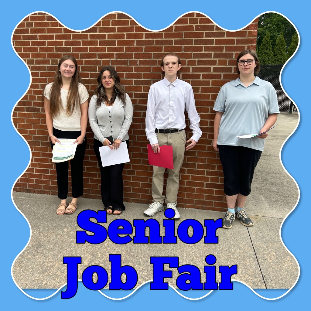 4 high school students, three female, one male, dressed in workplace casual and standing against a brick wall