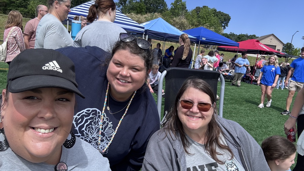 Teachers on a field at special olympics
