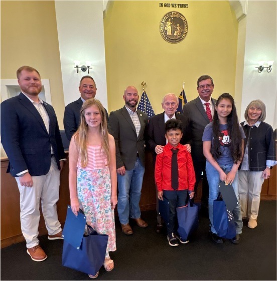 The Randolph County Commissioners recognized some outstanding young talent at their May 4 meeting! 🇺🇸 First-place winners of the America 250 Flag/Essay Project from Asheboro City Schools, Randolph County School System, and Uwharrie Charter Academy were honored for their creativity and hard work. Each student received a certificate and special goodies in celebration of their achievement. A big congratulations to RCSS 4th grader Santiago and all the winners for this well-deserved recognition! 👏