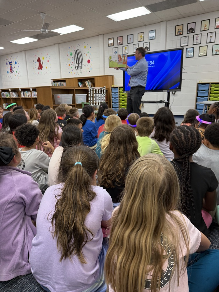 Dr. Cross reading to 2nd Graders