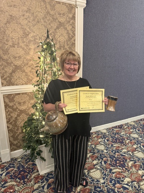 Ms. Donna Underwood receiving her recognition for 25 years of service and upcoming retirement.