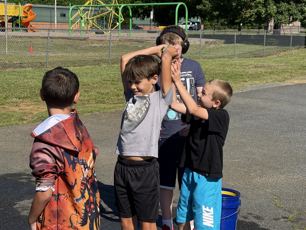 Students playing pass the sponge during field day.