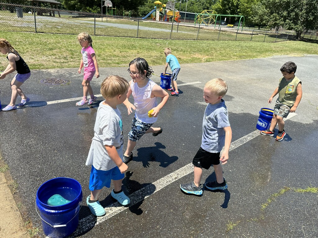Students playing a water game during field day.